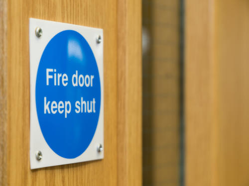 Fire doors and fire safety signs make up only part of the total fire protection a building requires